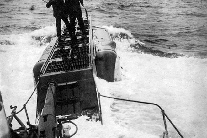 2 crewmen on the bough of their submarine